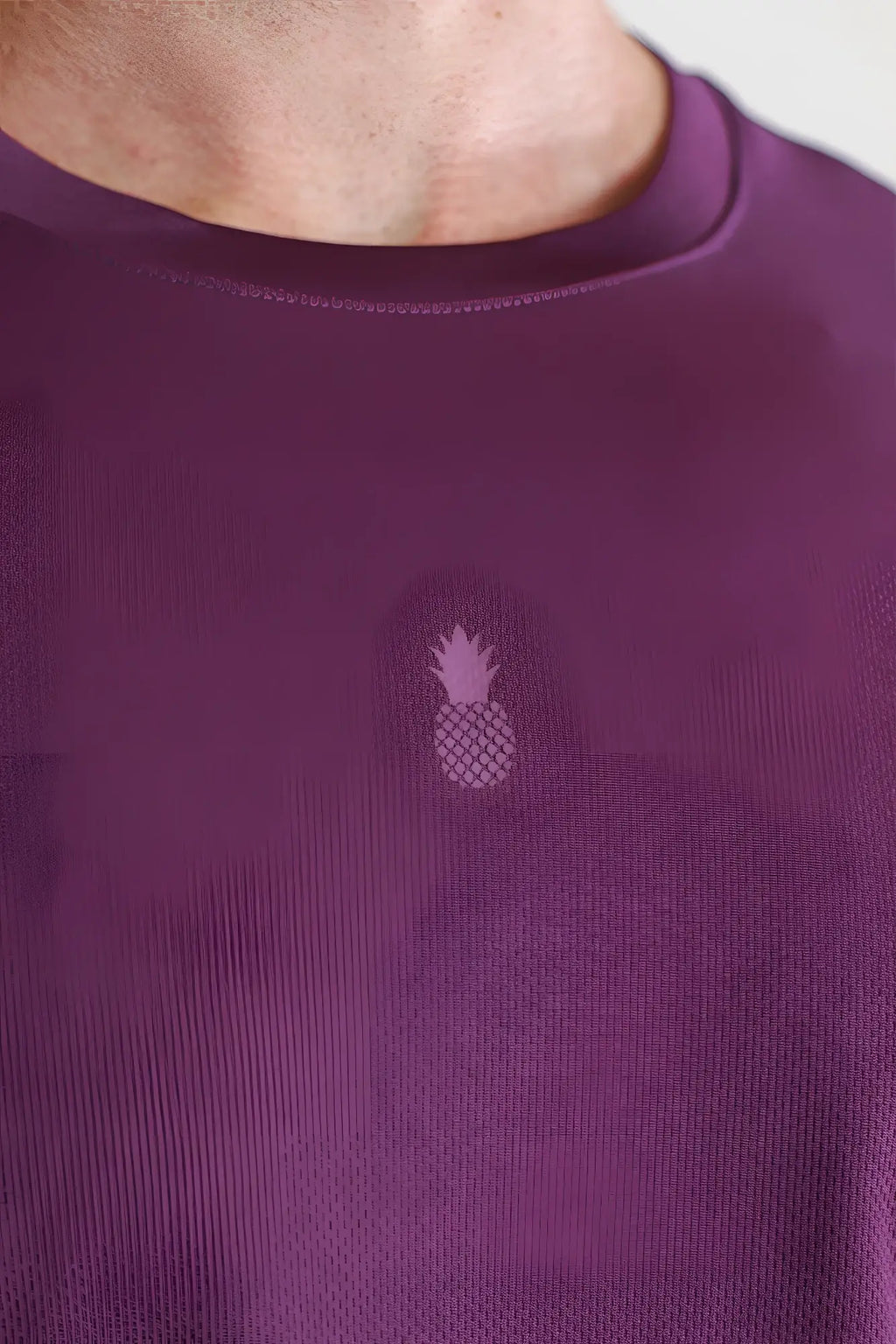 Cool-dry oversized relaxed crop top in plum purple with a subtle embroidered pineapple logo on the chest