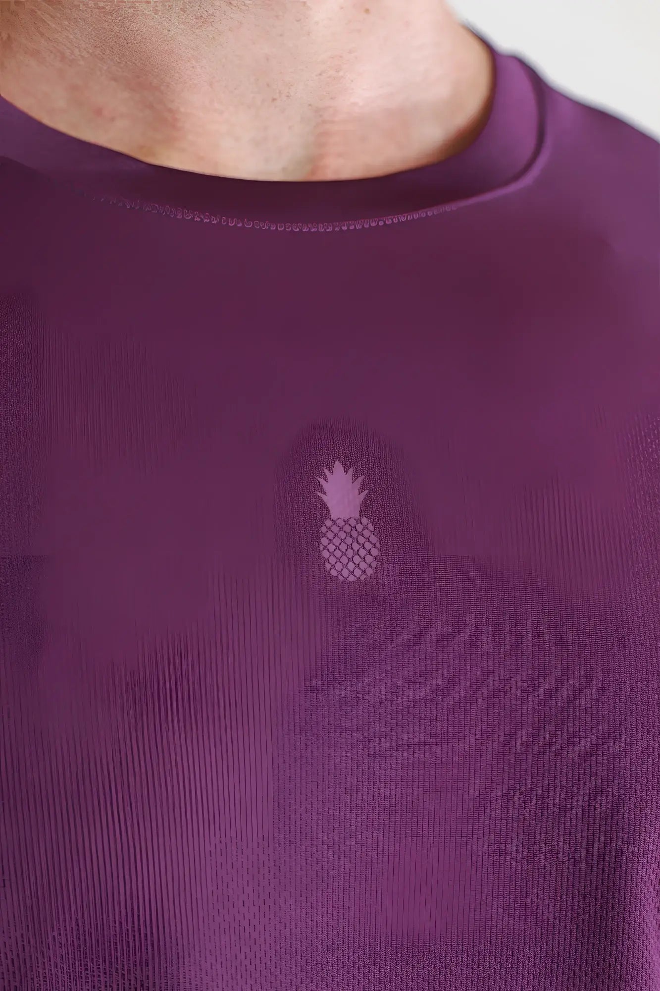 Cool-dry oversized relaxed crop top in plum purple with a subtle embroidered pineapple logo on the chest