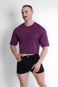 Purple cool-dry oversized relaxed crop top with subtle chest logo made from breathable fabric for casual wear