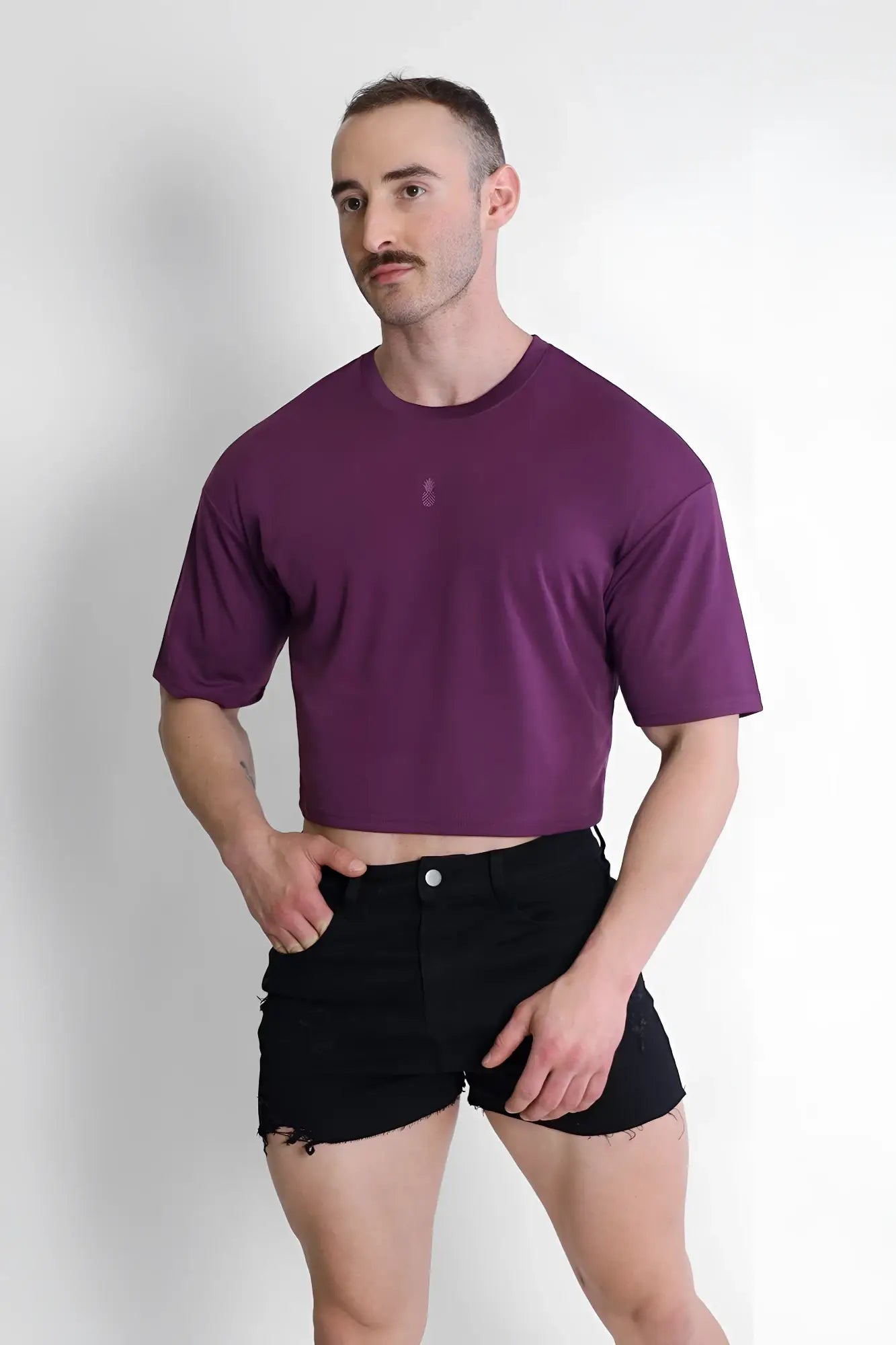 Purple cool-dry oversized relaxed crop top with subtle chest logo made from breathable fabric for casual wear