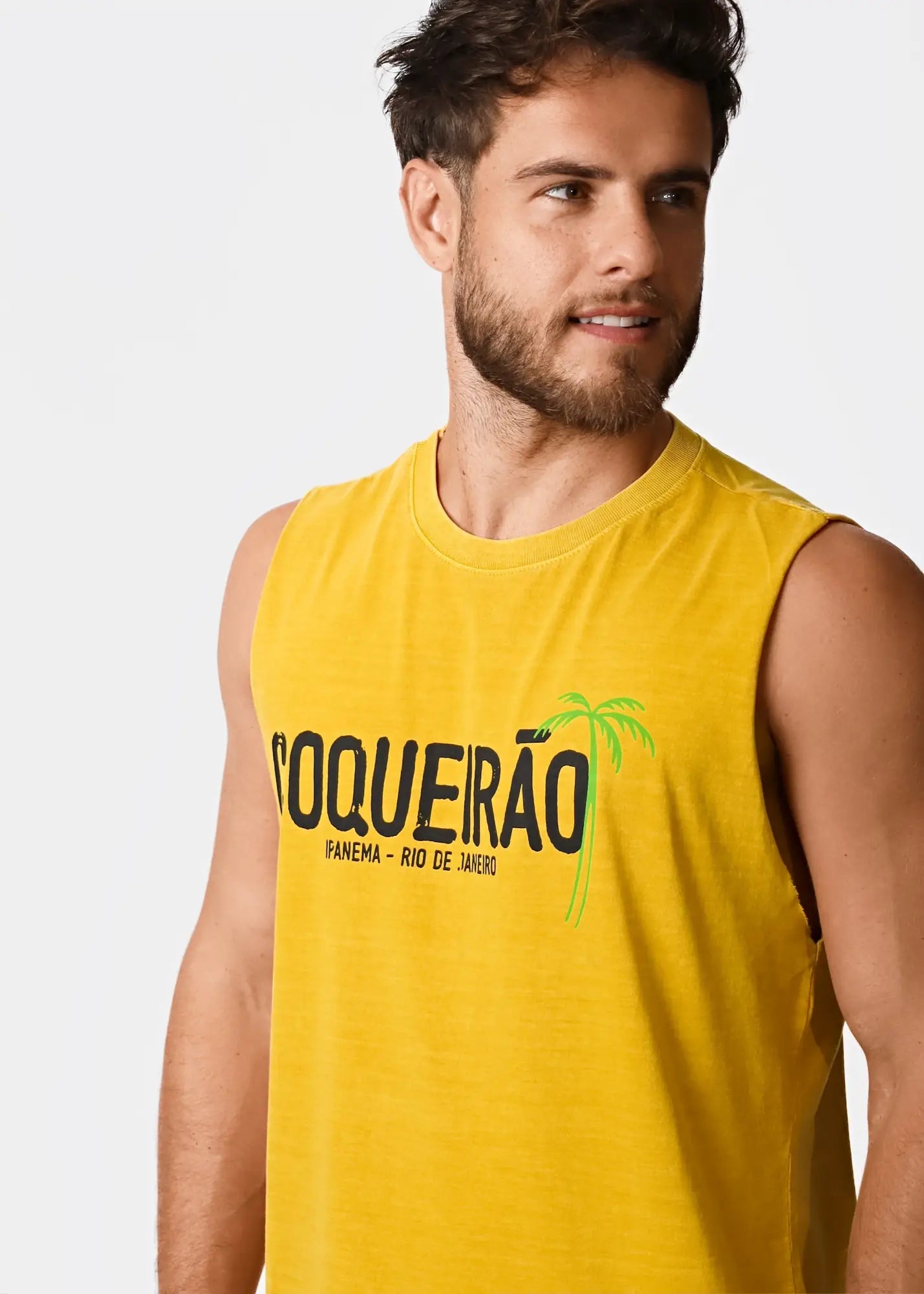 Bright yellow sleeveless men’s t-shirt coqueirão with bold black lettering and green palm tree graphic design