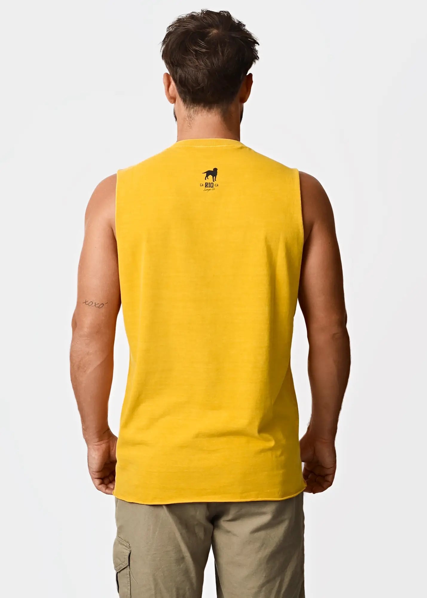 Bright yellow men’s sleeveless tank top coqueirão with small black dog logo and text on the back side