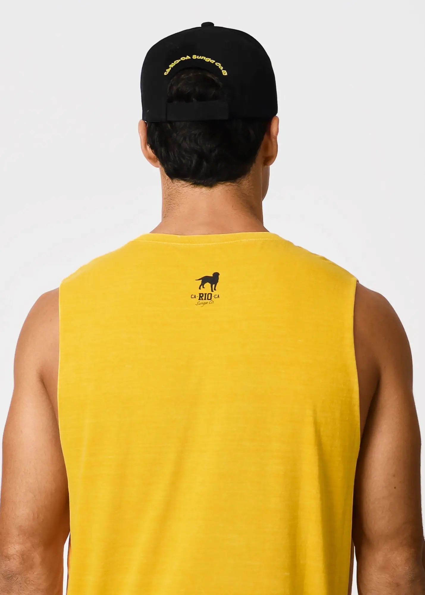 Back of a vibrant yellow coqueirão men’s sleeveless tank top with small black dog logo and ca rio ca text