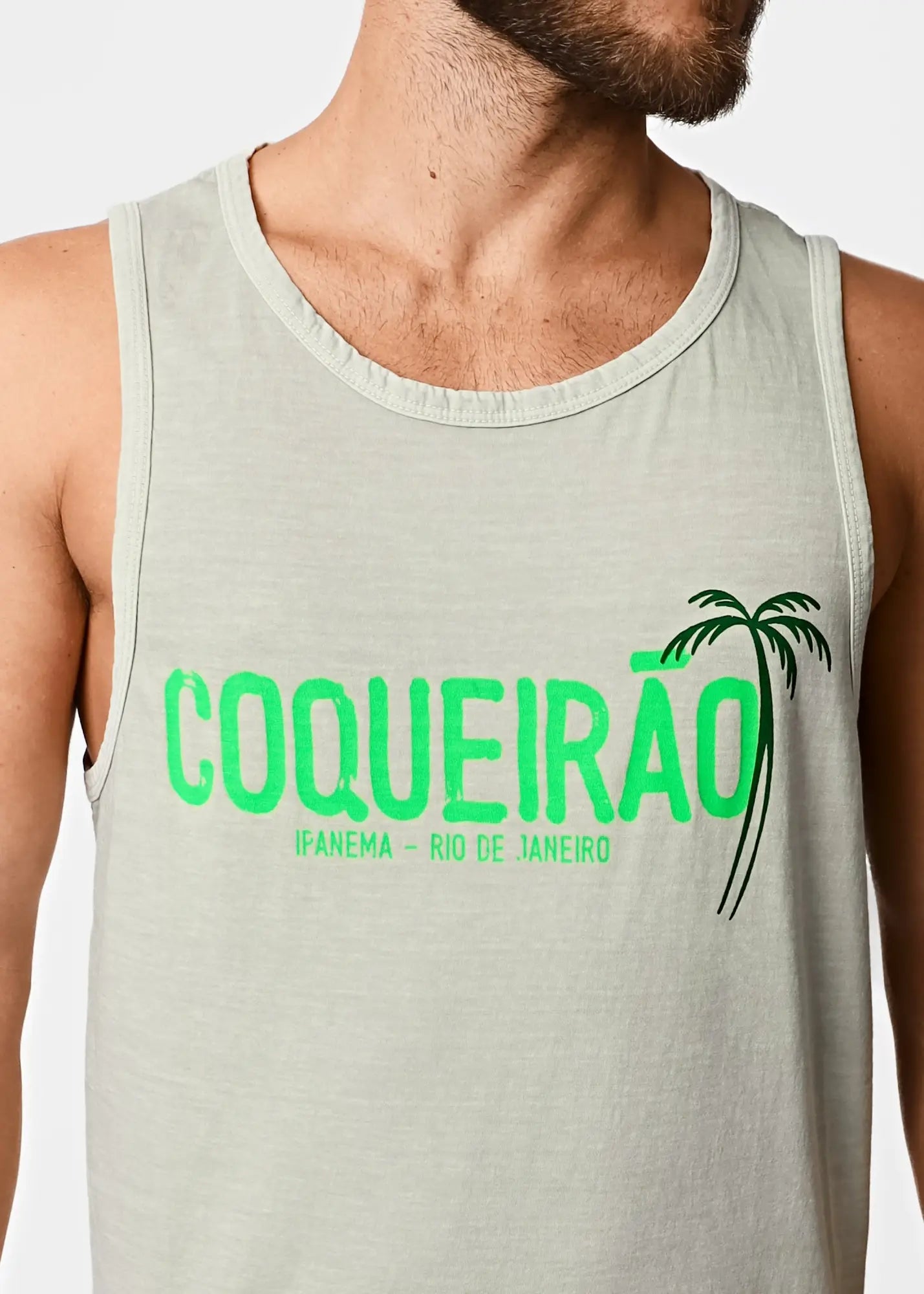 Light gray cotton men’s tank top featuring bold green coqueirão text with palm tree graphic and smaller black lettering below