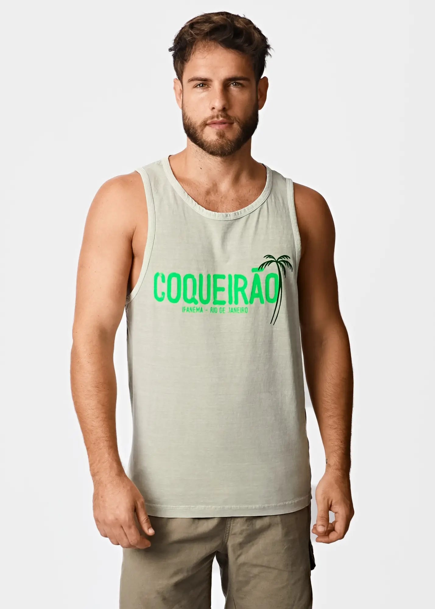 Light green cotton men’s tank top with bold neon green coqueirão text and palm tree graphic