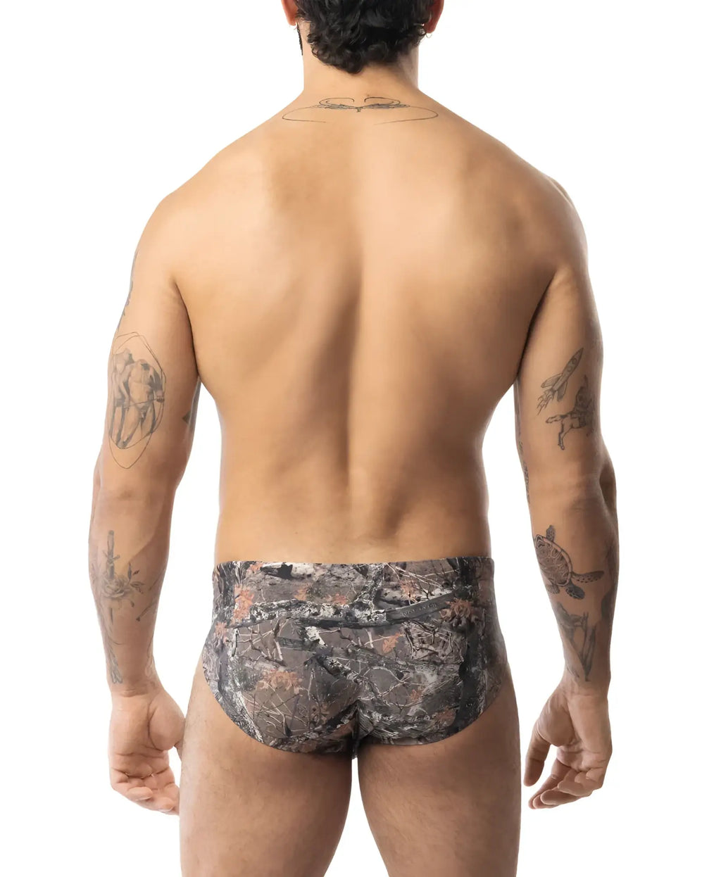 Camouflage-patterned core bikini briefs in earthy tones with detailed foliage design for outdoor style