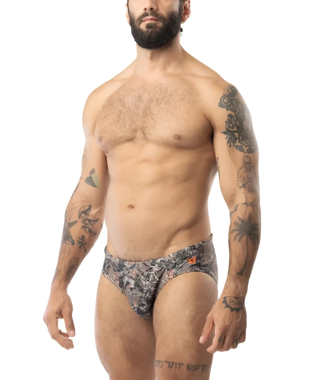 Patterned core square cut swim trunks in timber camouflage with subtle orange accents for casual beachwear