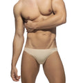 Beige cotton bikini brief with a sleek minimalist design and a subtle brand tag at the waistband