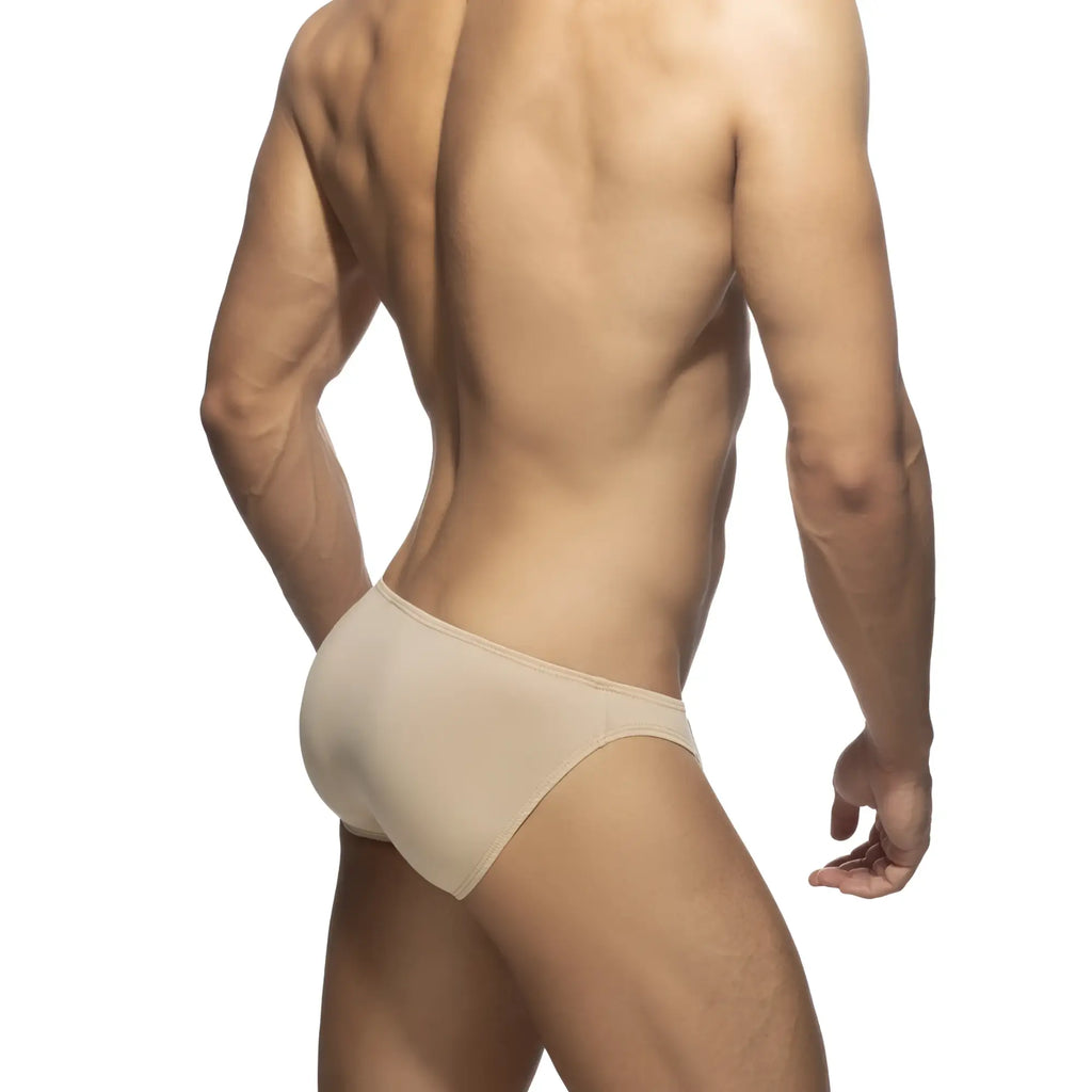 Beige cotton bikini brief with a smooth seamless design and form-fitting style for comfortable everyday wear