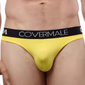 Bright yellow cover male cm115 bikini brief with black waistband and white brand lettering in form-fitting design
