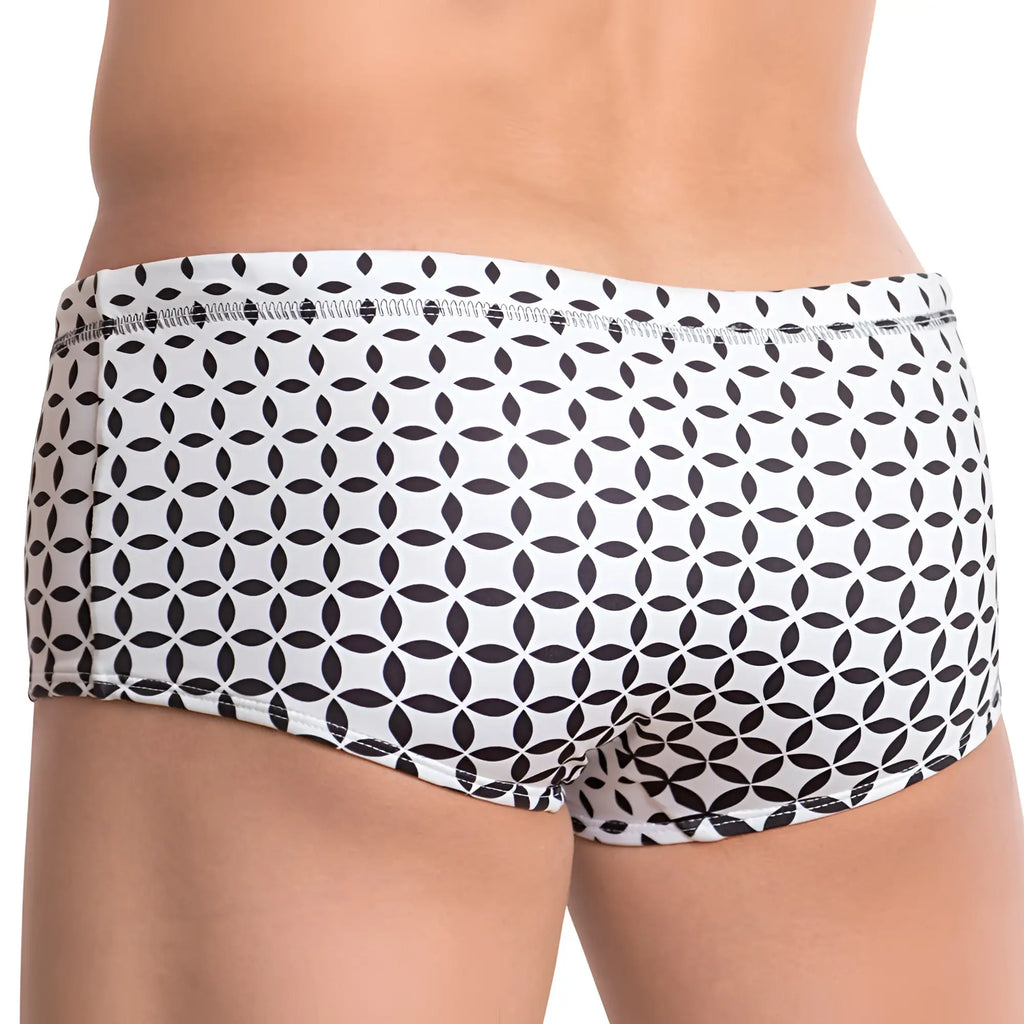 White cover male cmh008 swimwear swim trunks with a black geometric overlapping leaf pattern for beach use