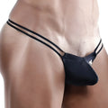 Black sleek form-fitting Cover Male CMK024 thong with dual thin straps shown from the back side
