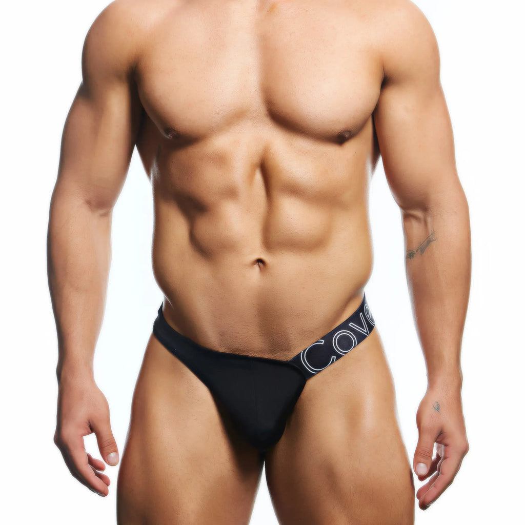 Black men’s briefs with navy blue waistband and white lettering from cover male cmk083 thong collection
