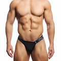 Black men’s briefs with navy blue waistband and white lettering from cover male cmk083 thong collection
