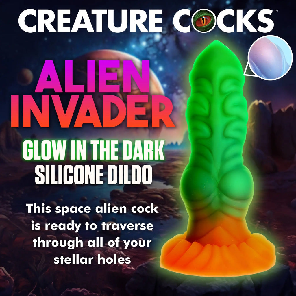 Creature Cocks Alien Invader glow-in-the-dark silicone dildo with a green ribbed top and orange flared base.