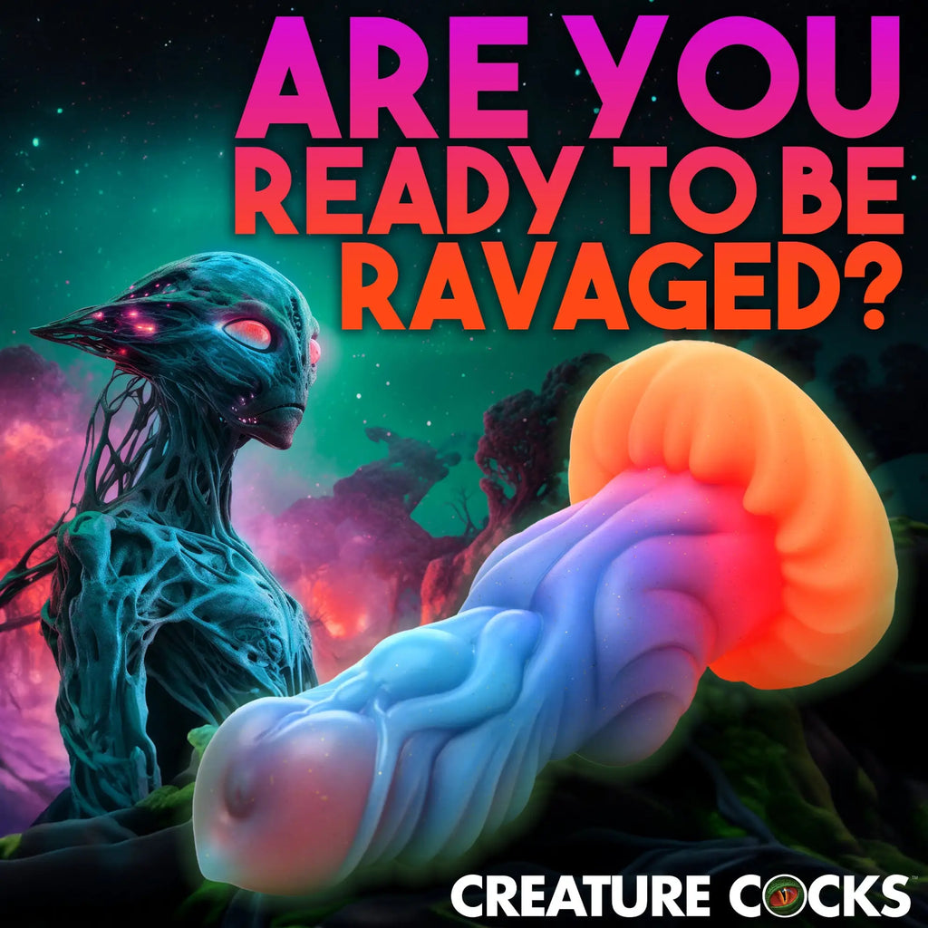 Creature Cocks Alien Invader glow-in-the-dark silicone dildo with a blue shaft and orange mushroom-shaped tip.
