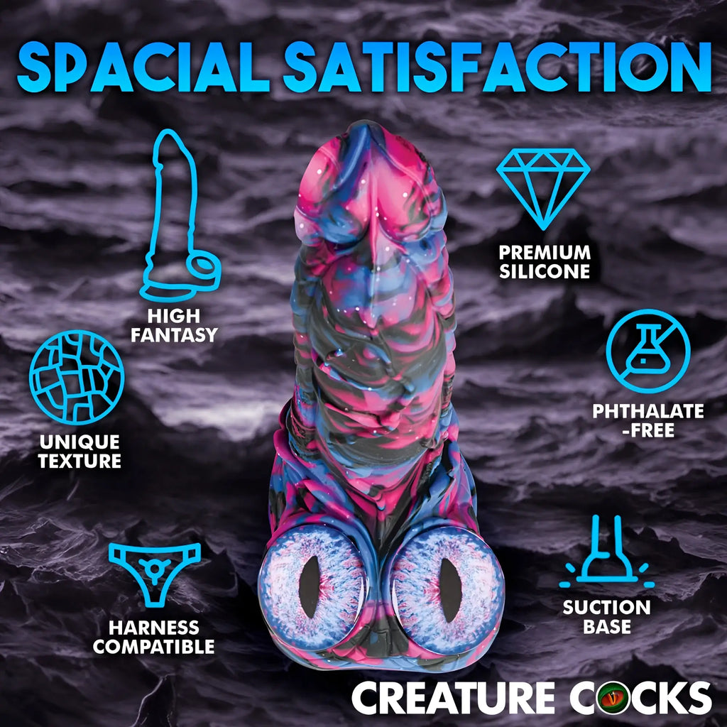 Creature Cocks Alienoid dildo in a pink, blue, and black swirl pattern with two large, detailed alien eye accents.