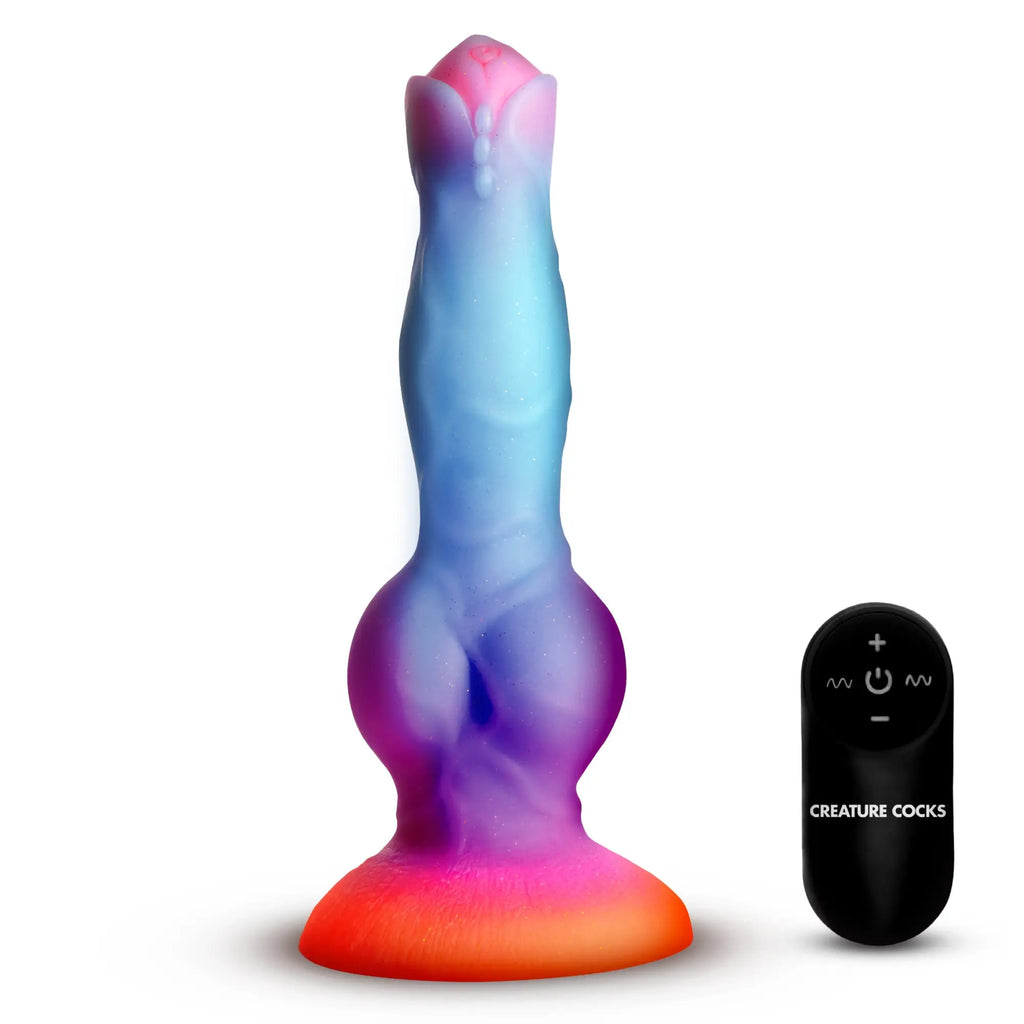 Creature Cocks Astro dildo in glittery, multi-colored ombre silicone with a suction base and matching remote control.