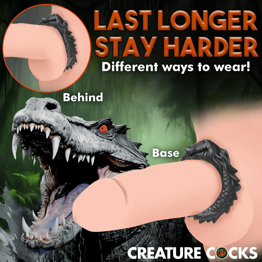 Creature Cocks black silicone caiman cock ring, shown worn two ways against a graphic background of a caiman.