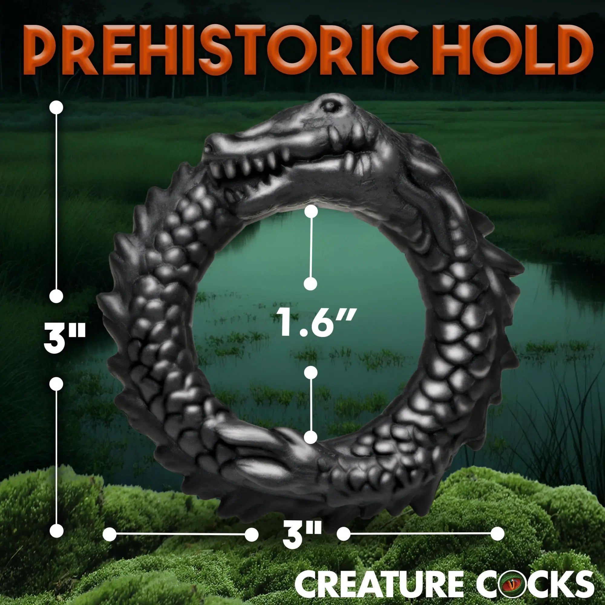 Creature Cocks black silicone caiman cock ring, shaped like a circular crocodile with textured scales and dimension labels.