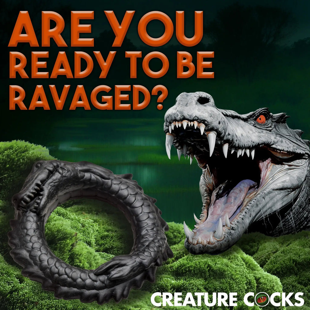 Black, textured Creature Cocks Caiman silicone cock ring shown in a swampy, alligator-themed promotional image.