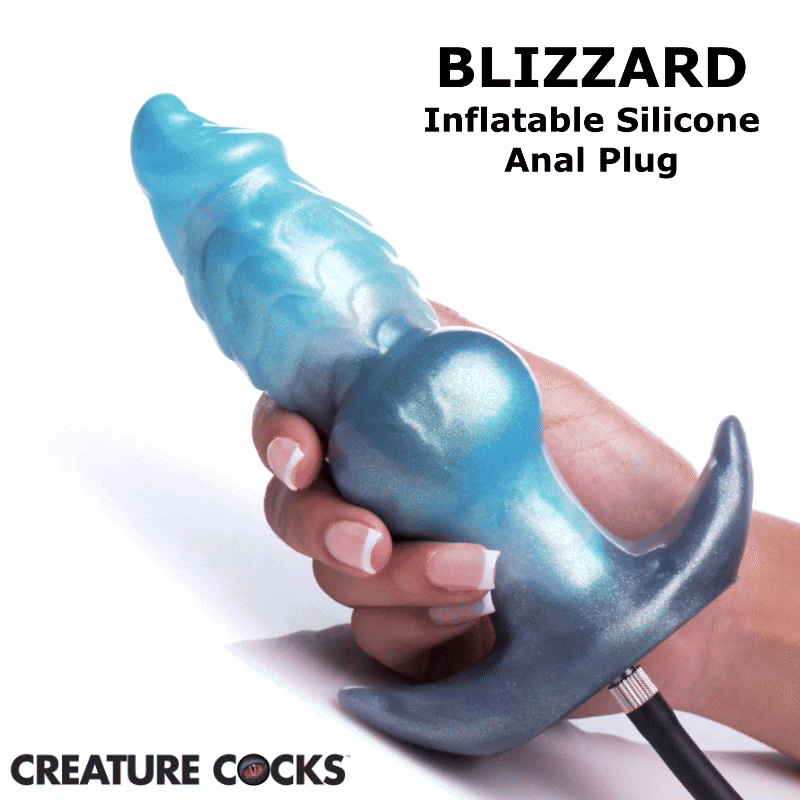 Creature Cocks Blizzard: A shimmery, blue-to-grey gradient inflatable silicone anal plug held in a hand.