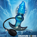 Creature Cocks Blizzard inflatable blue, sparkly silicone anal plug with black hand pump, set against an icy background.