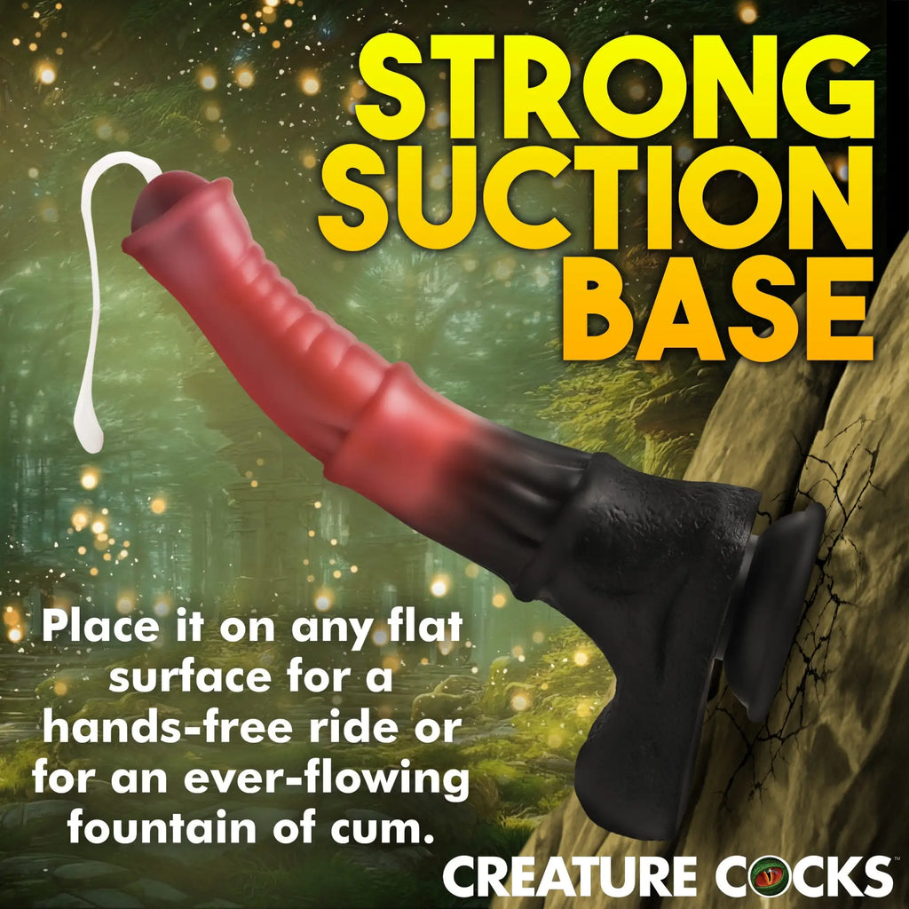 Creature Cocks Centaur silicone dildo with a black suction base and red, ribbed shaft against a forest background.