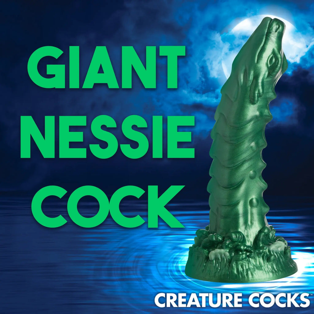 Metallic green Creature Cocks Cockness Monster silicone dildo shaped like a sea creature against a dark moonlit lake.
