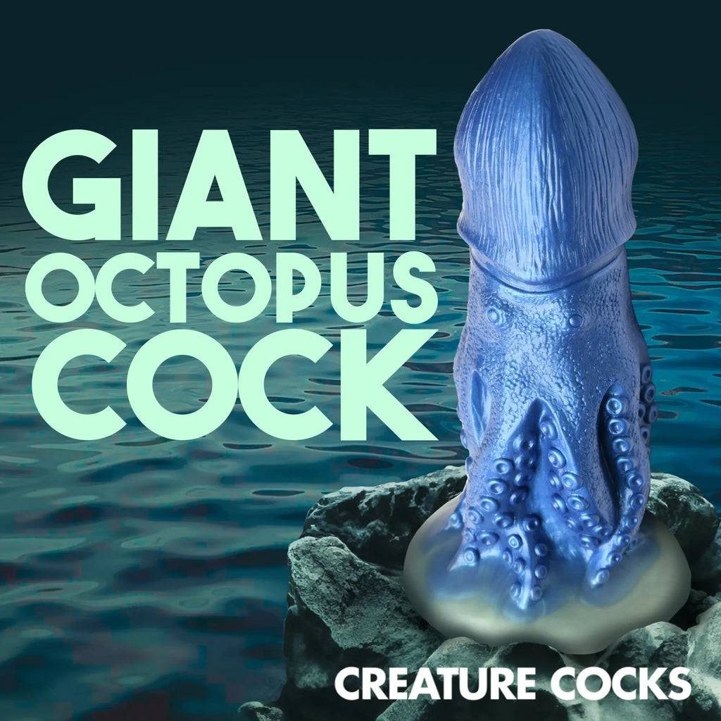 Blue Creature Cocks Cocktopus silicone dildo with octopus tentacle textures, standing on a rock over water.