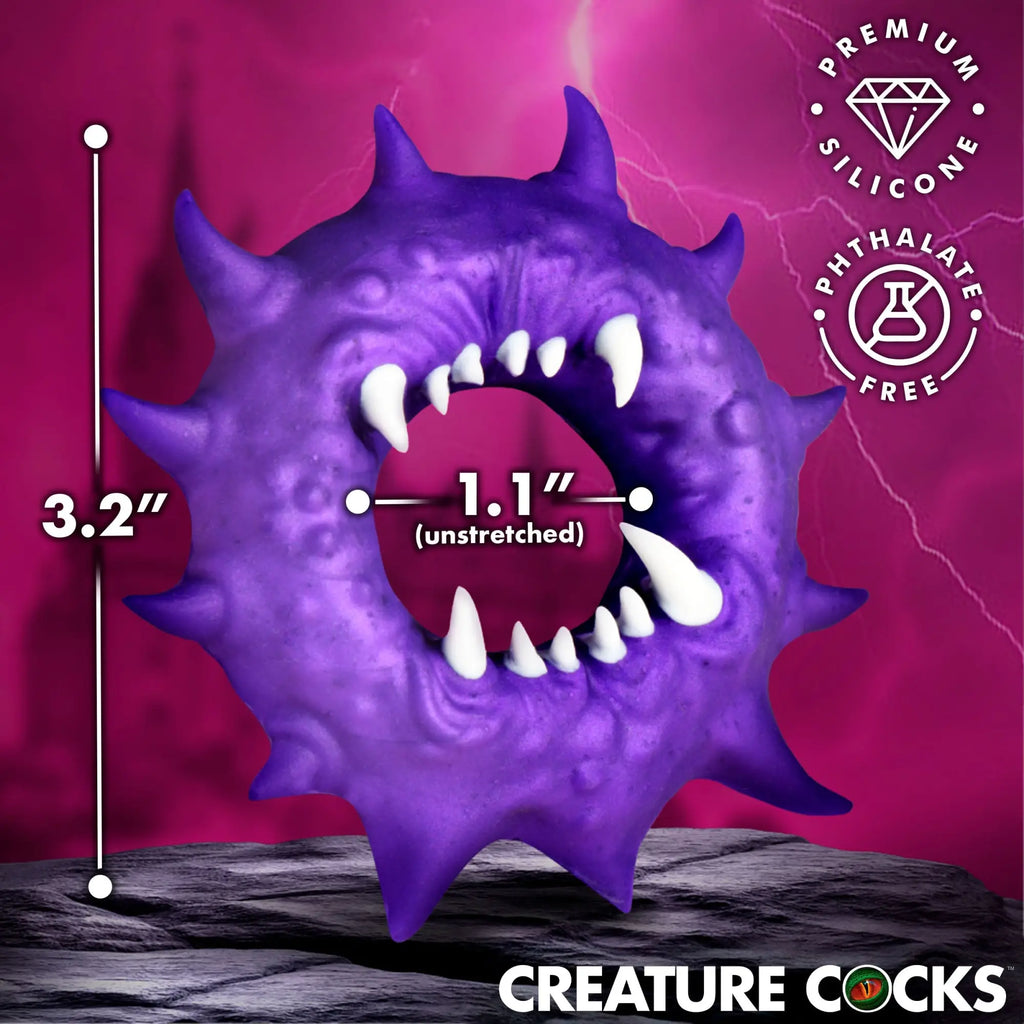 Creature Cocks Constrictor purple silicone cock ring with spiky texture and white fangs, showing size measurements.