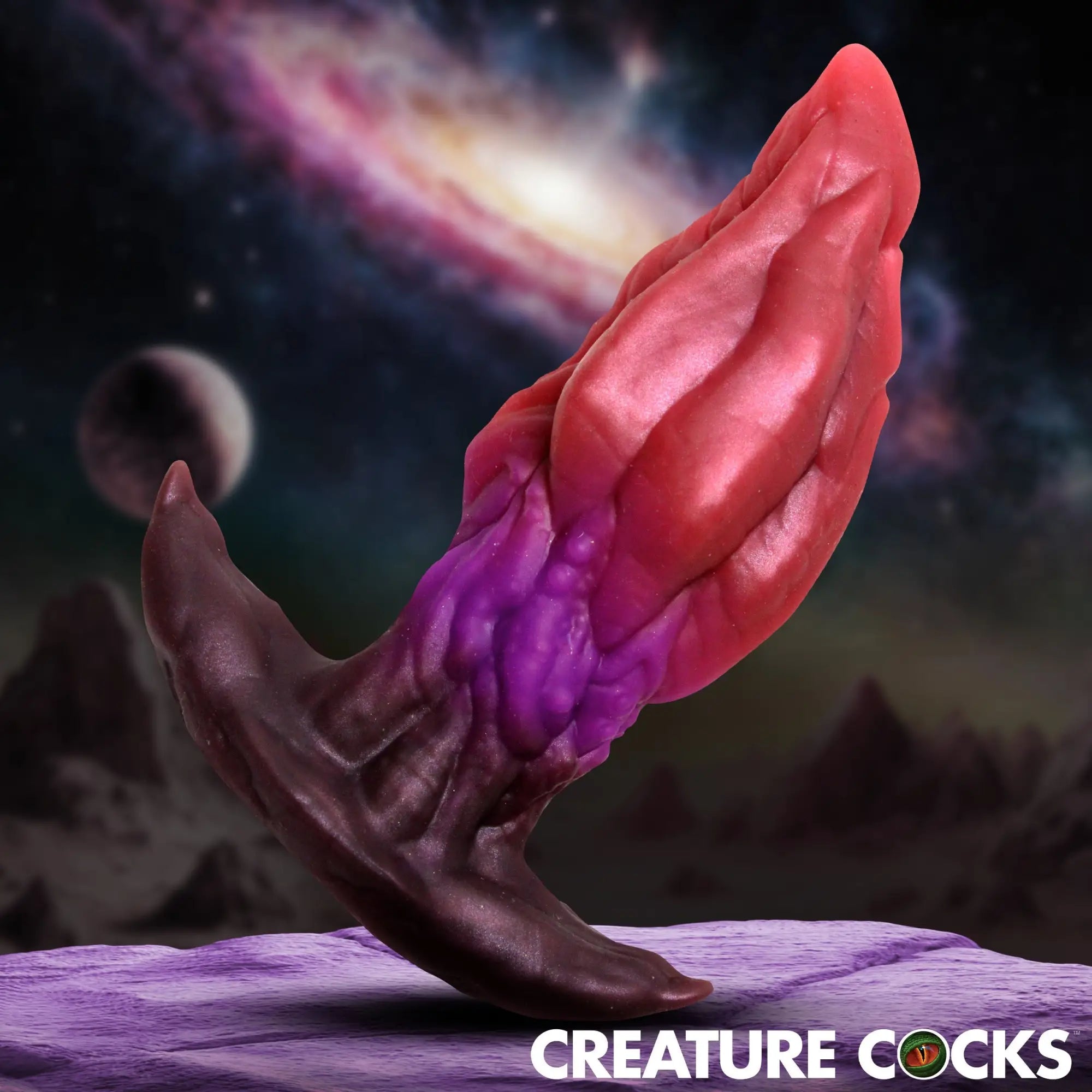 Creature Cocks Crawler silicone butt plug in a dark red, purple, and black gradient with a textured, alien design.