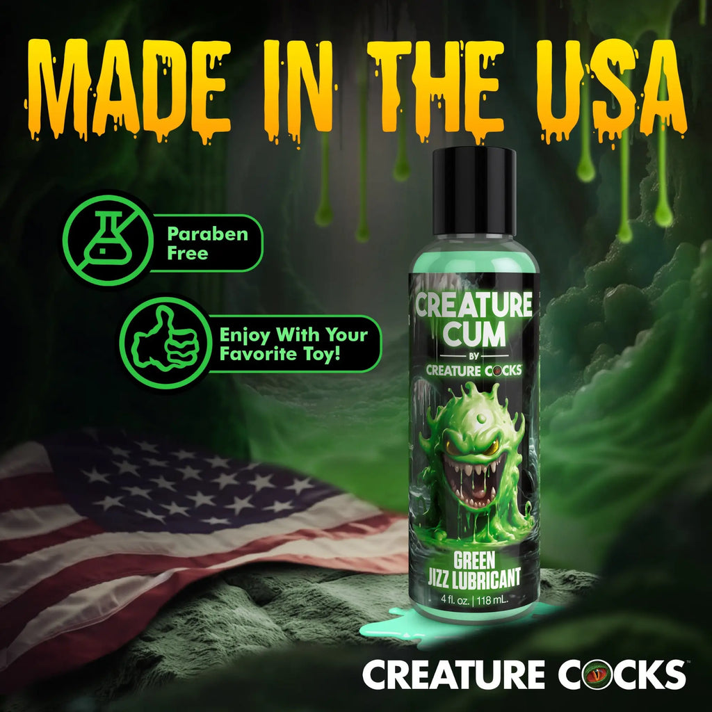 A bottle of Creature Cocks Creature Cum Green Jizz Lubricant against a USA flag background.