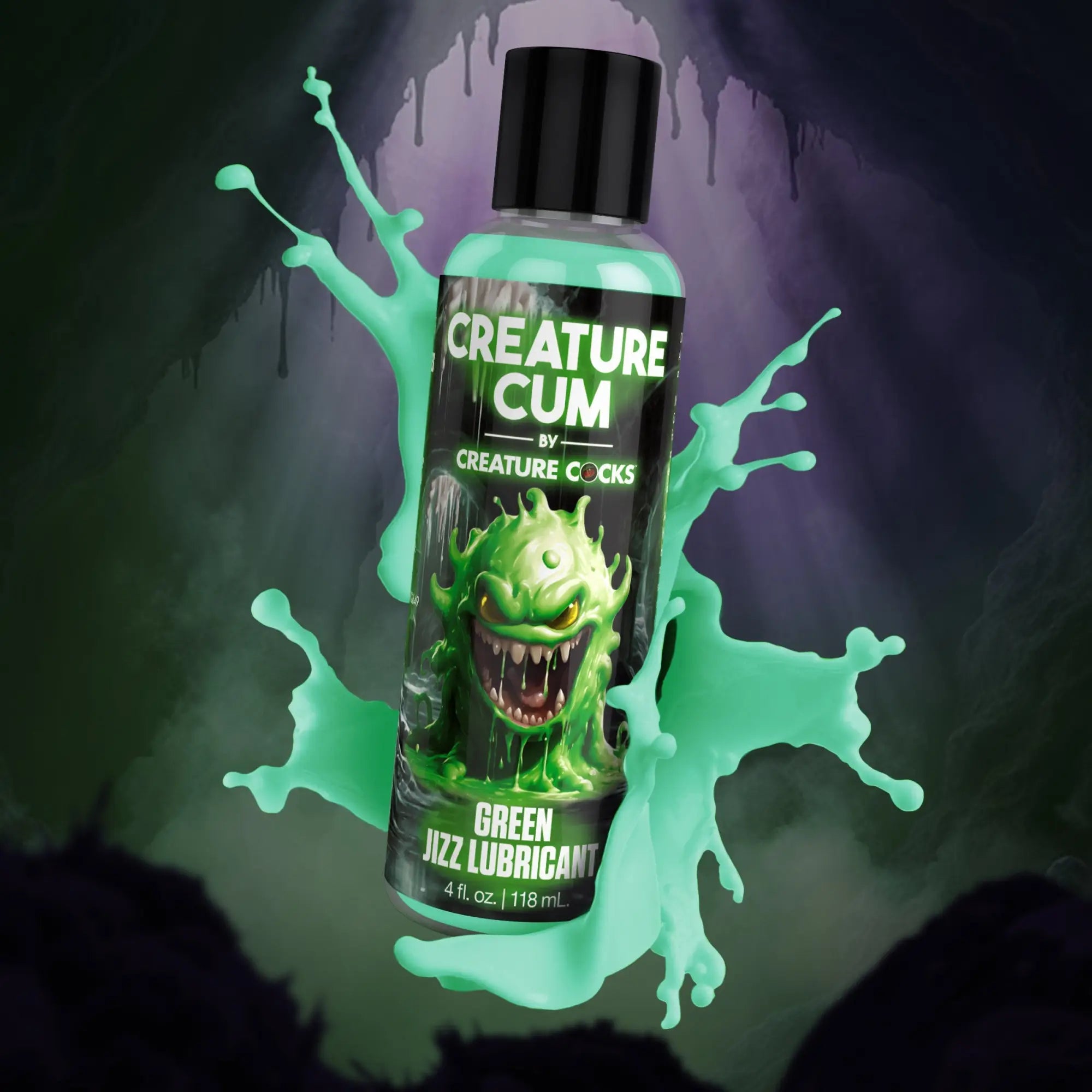 Creature Cocks Creature Cum green lubricant bottle, featuring a cartoon monster label, surrounded by green liquid splashes.