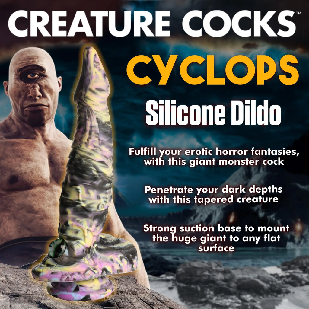 Creature Cocks Cyclops silicone dildo in a marbled purple, yellow, and black colorway with a suction cup base.