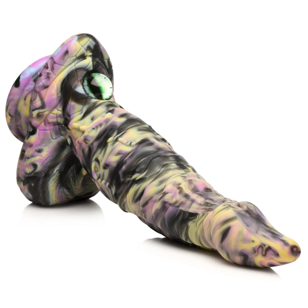 Creature Cocks Cyclops monster dildo in a yellow, purple, and black marbled silicone with a green glass-style eye.