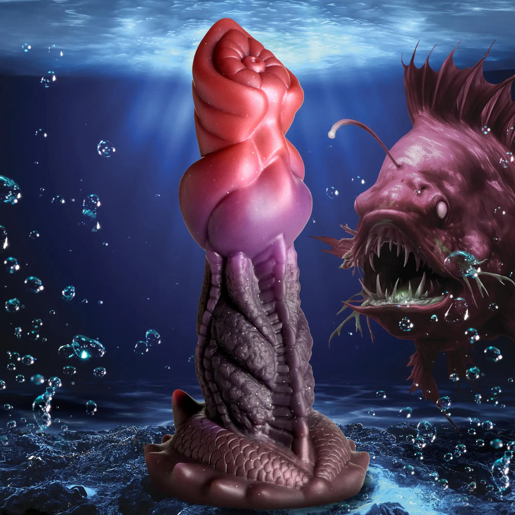 Creature Cocks Deep Diver dildo: a red-to-purple silicone fantasy toy with textured detailing, shown underwater.