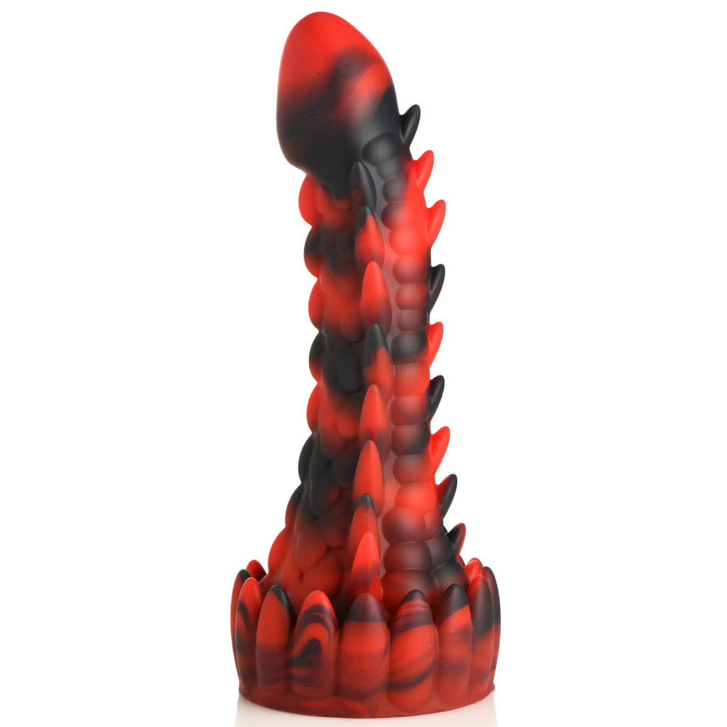 Creature Cocks Demon Rising silicone dildo in a black and red swirled color with a scaly, spiked dragon-like texture.
