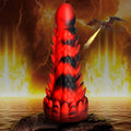 Creature Cocks Demon Rising silicone dildo in red and black, featuring a textured, scaly dragon-inspired design.