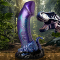 Creature Cocks Dino-Dick: A shimmering purple, textured silicone dildo in a jungle setting with a T-Rex background.