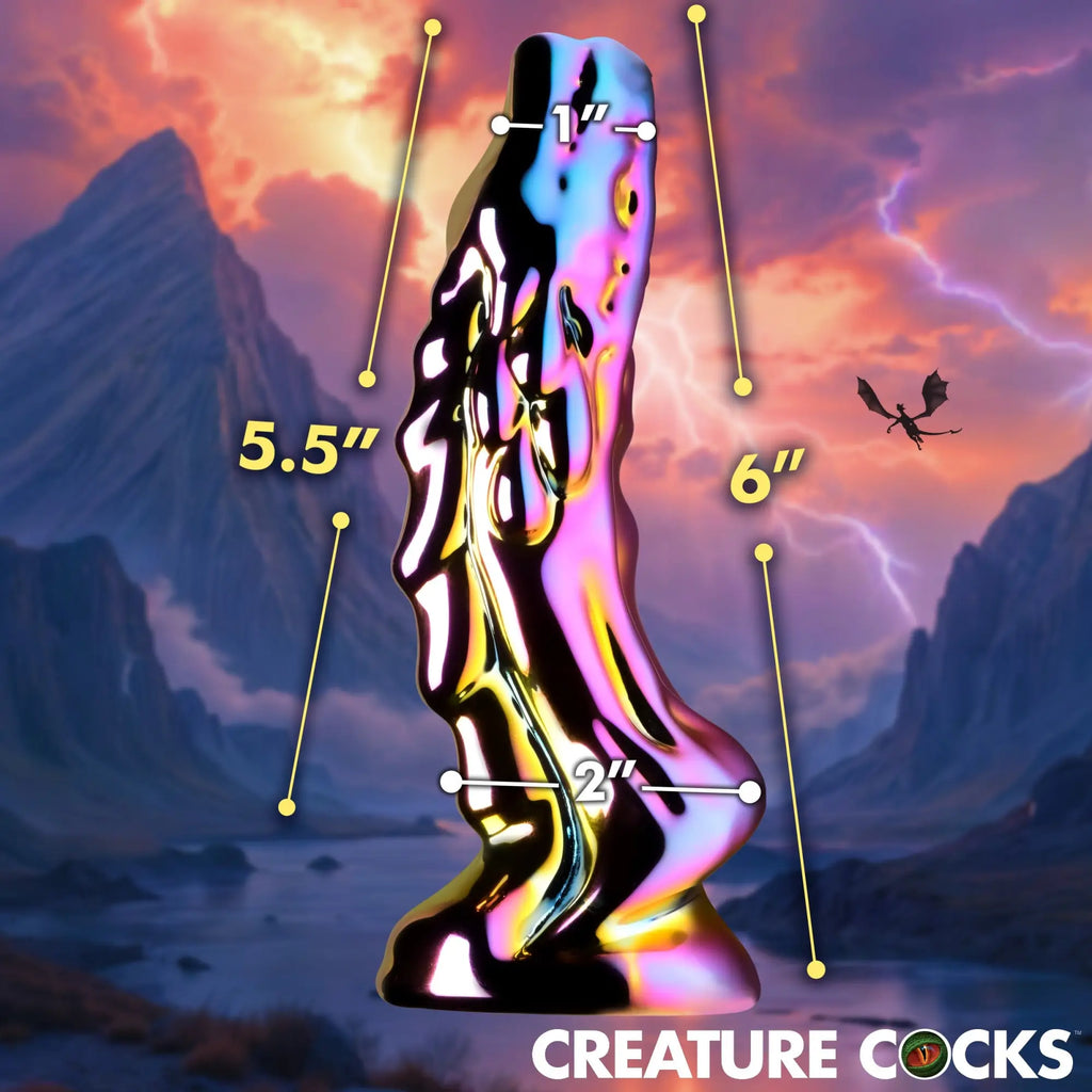 Creature Cocks Dragon Glass dildo in iridescent, metallic finish with labeled dimensions against a fantasy landscape.