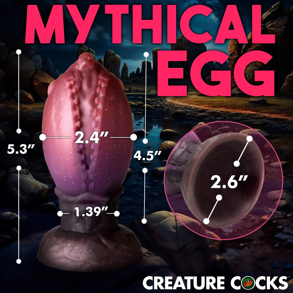 Creature Cocks Dragon Hatch: a purple-to-black gradient silicone egg with textured, cracked-shell detailing.
