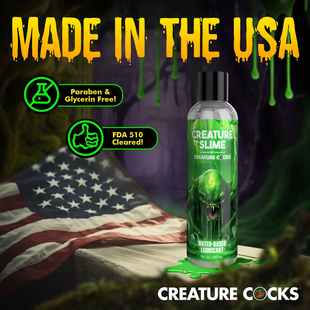 Creature Slime water-based lubricant bottle with green monster art, American flag background, and "Made in the USA" text.