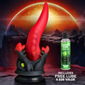Creature Cocks Dragon Roar red silicone dildo with black textured base and a bottle of Creature Slime lubricant.