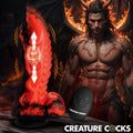 Creature Cocks Dragon Thrust red and black silicone vibrating dildo with remote, shown with a fiery dragon-man background.
