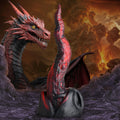 Creature Cocks Dragon Tongue silicone dildo in black and red, shown against a fiery dragon and volcanic landscape.