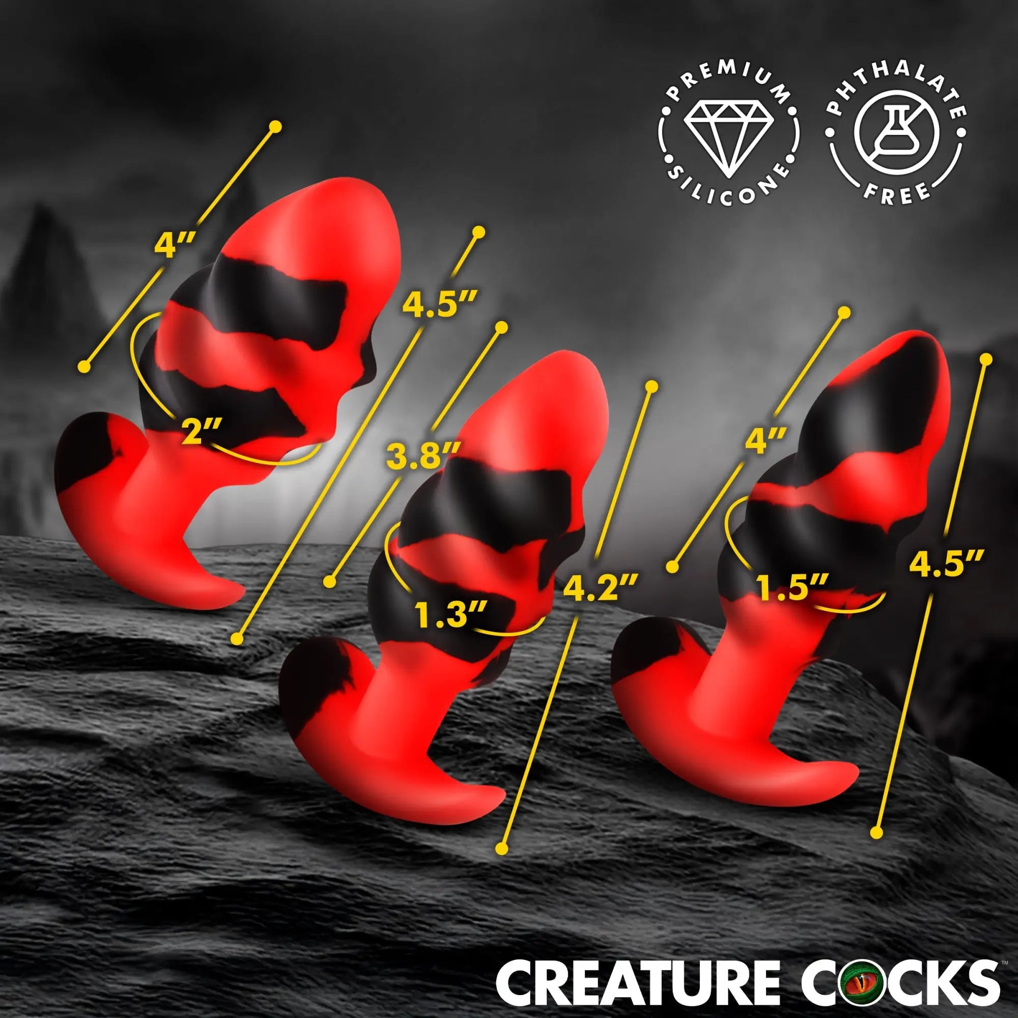 Creature Cocks Dragon Trainer silicone butt plug set in red and black, shown with size measurements on a dark surface.