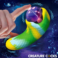 Creature Cocks Electric Eye vibrator: A green and yellow textured, curved device with a glowing purple plasma orb top.