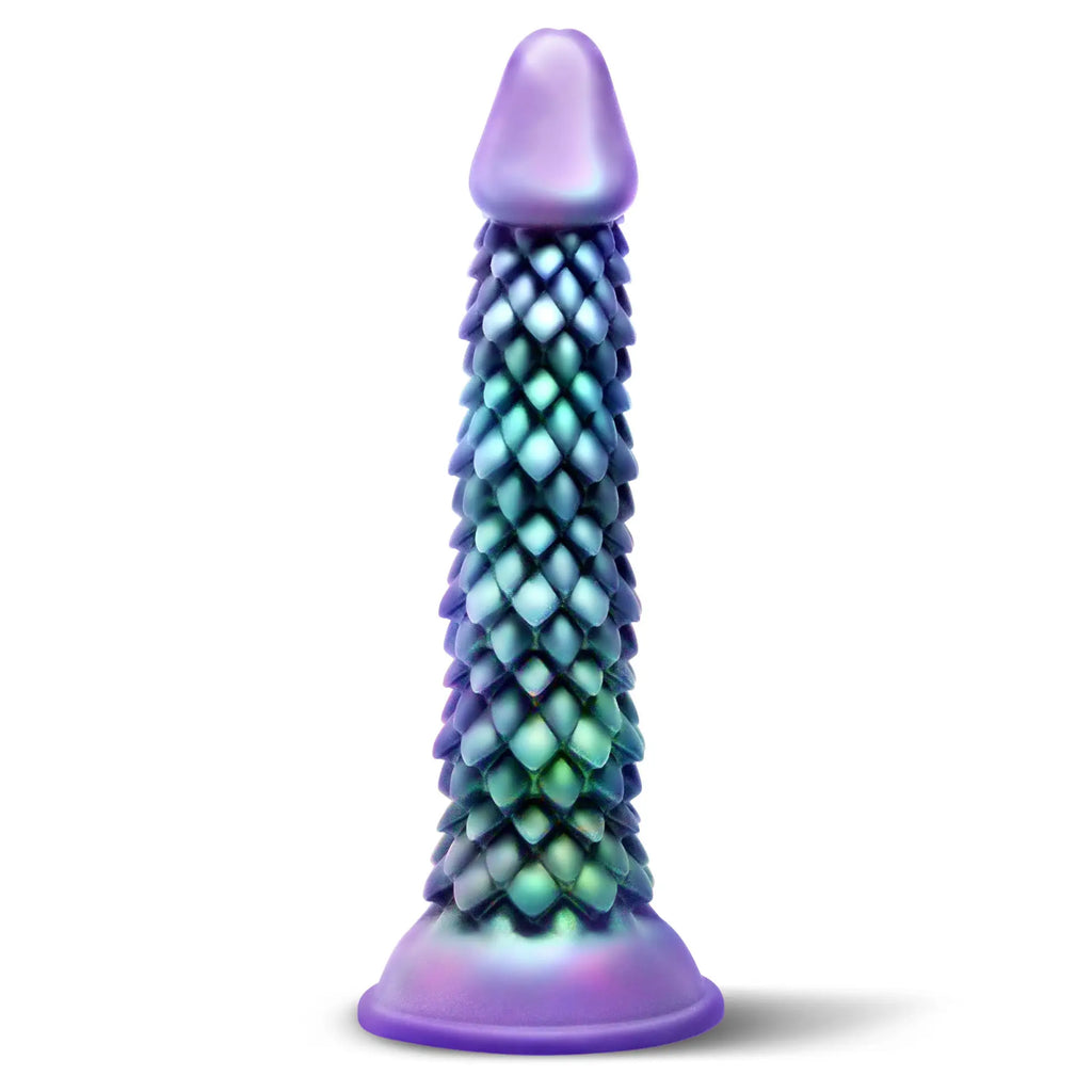 Creature Cocks Eryndor silicone dildo with an iridescent blue-green dragon scale texture and a smooth purple base.