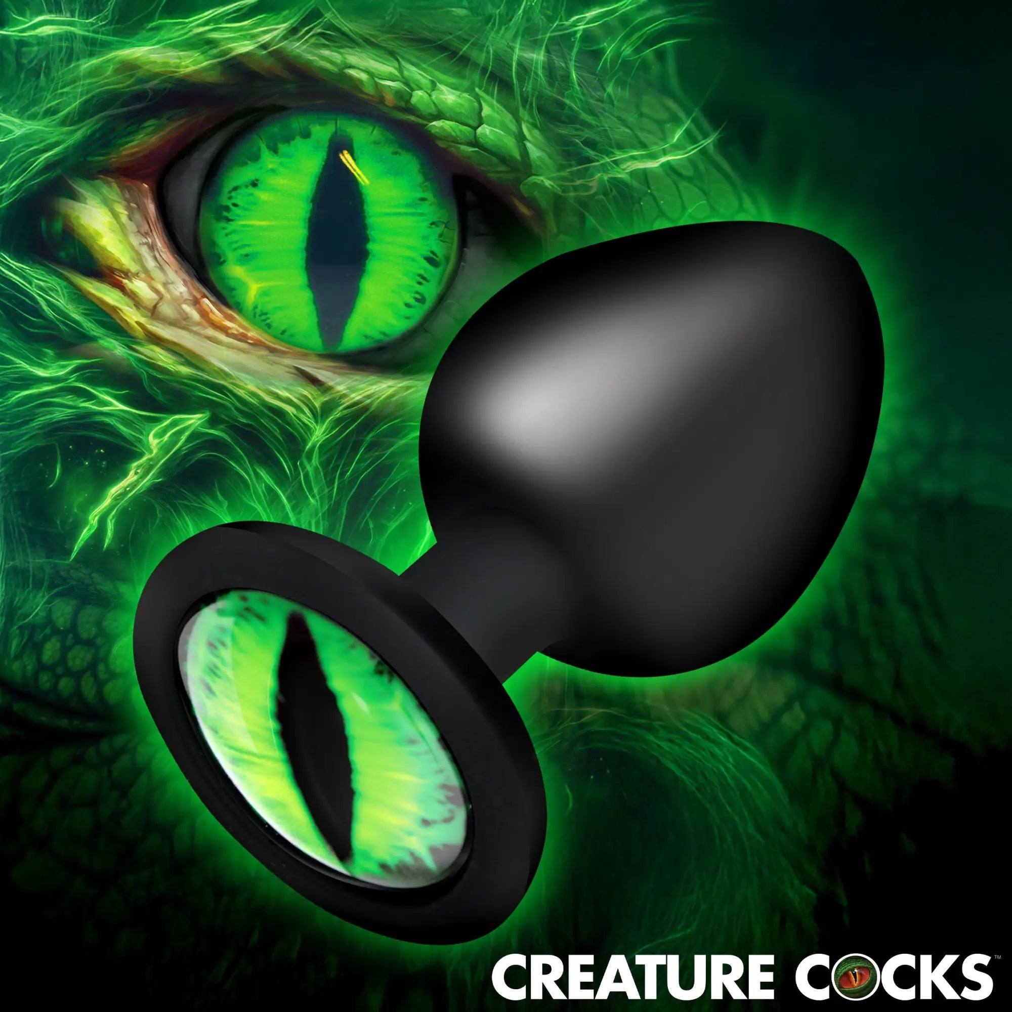 Creature Cocks Creature Eye butt plug: A matte black silicone plug with a bright green reptilian eye on the base.